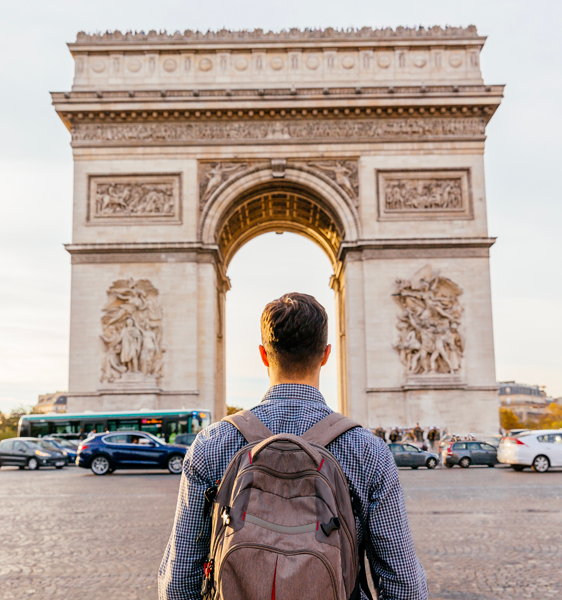 Man in front of arch