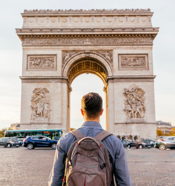 Man in front of arch